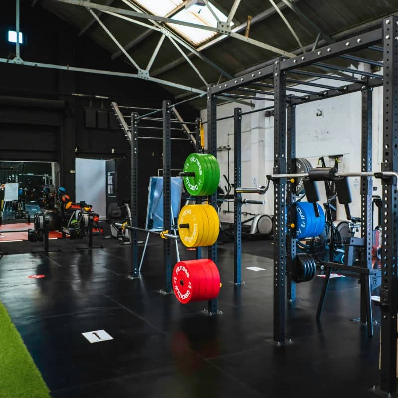 Gym with colorful barbell rack