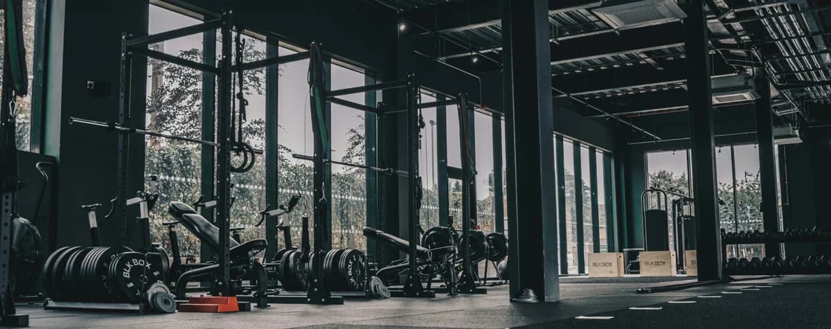 Dark modern gym with glass walls